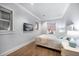 Bright bedroom with a king-size bed and water views at 158 Brightwater Dr # 1, Clearwater Beach, FL 33767