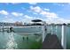 Private boat lift on a wooden dock at 158 Brightwater Dr # 1, Clearwater Beach, FL 33767