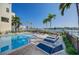 Inviting heated pool with surrounding lounge chairs at 158 Brightwater Dr # 1, Clearwater Beach, FL 33767