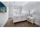 Bedroom with a king-size bed and large window at 158 Brightwater Dr # 1, Clearwater Beach, FL 33767