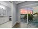 Elegant bathroom with double vanity, soaking tub, and water views at 158 Brightwater Dr # 1, Clearwater Beach, FL 33767