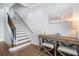 Light and airy entryway with a console table and two ottomans at 158 Brightwater Dr # 1, Clearwater Beach, FL 33767