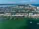 Aerial view showcasing waterfront property with private boat dock at 158 Brightwater Dr # 1, Clearwater Beach, FL 33767