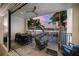Large patio with outdoor dining set and relaxing seating at 158 Brightwater Dr # 1, Clearwater Beach, FL 33767