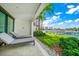 Private patio with lounge chairs and water views at 158 Brightwater Dr # 1, Clearwater Beach, FL 33767
