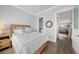 Bright bedroom with light wood furniture and a coastal-themed decor at 158 Brightwater Dr # 1, Clearwater Beach, FL 33767