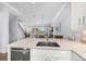 Modern kitchen with island, double sink, and water views at 158 Brightwater Dr # 1, Clearwater Beach, FL 33767
