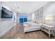 Spacious main bedroom with a king-size bed and water views at 158 Brightwater Dr # 1, Clearwater Beach, FL 33767