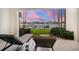 Relaxing patio with lounge chairs and sunset views at 158 Brightwater Dr # 1, Clearwater Beach, FL 33767