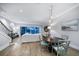 Open living and dining area with hardwood floors and water views at 158 Brightwater Dr # 1, Clearwater Beach, FL 33767