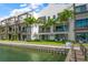 Luxury waterfront property with private dock and lush landscaping at 158 Brightwater Dr # 1, Clearwater Beach, FL 33767