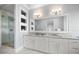Modern bathroom with a double vanity, a soaking tub, and a glass shower at 158 Brightwater Dr # 1, Clearwater Beach, FL 33767
