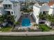 Resort-style pool with spacious deck and lounge chairs at 158 Brightwater Dr # 1, Clearwater Beach, FL 33767