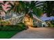 Two-story home with palm trees and brick driveway at 10109 Tarpon Dr, Treasure Island, FL 33706