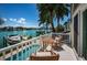 Private balcony overlooking the water, with seating area and beautiful views at 10109 Tarpon Dr, Treasure Island, FL 33706