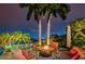 Cozy fire pit surrounded by comfortable seating; ideal for evening gatherings at 10109 Tarpon Dr, Treasure Island, FL 33706