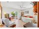 Bedroom with daybed and sliding doors leading to the pool area at 366 6Th N Ave, Tierra Verde, FL 33715