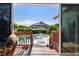 View from the house showcasing a refreshing pool, patio furniture, and lush landscaping at 366 6Th N Ave, Tierra Verde, FL 33715