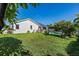 Large backyard with grassy area and swimming pool at 366 6Th N Ave, Tierra Verde, FL 33715