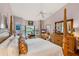 Main bedroom with a king-size bed and dresser with mirror at 366 6Th N Ave, Tierra Verde, FL 33715