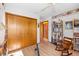 Bedroom with built-in shelving, rocking chair, and hardwood floors at 366 6Th N Ave, Tierra Verde, FL 33715