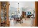 Charming dining room with glass-top table and access to the outdoors at 366 6Th N Ave, Tierra Verde, FL 33715