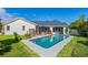Inviting pool area with a deck and lush landscaping at 366 6Th N Ave, Tierra Verde, FL 33715