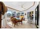 Sunroom features glass sliding doors opening to the pool at 366 6Th N Ave, Tierra Verde, FL 33715