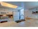 White kitchen cabinets and appliances, tan tile counters and sink at 7200 Ulmerton Rd # F2, Largo, FL 33771