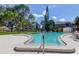 Community swimming pool with lounge chairs at 7200 Ulmerton Rd # F2, Largo, FL 33771