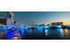 Night view of a lit-up pedestrian bridge over the water at 7200 Ulmerton Rd # F2, Largo, FL 33771