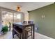 Bright dining area with table, bench, and chairs, near sliding glass door at 7200 Ulmerton Rd # F2, Largo, FL 33771