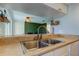 Double kitchen sink with brushed nickel faucet and tan countertop at 7200 Ulmerton Rd # F2, Largo, FL 33771