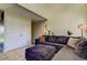 Living room with sectional sofa, high ceilings, and double doors at 7200 Ulmerton Rd # F2, Largo, FL 33771