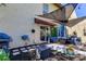 Private backyard with patio, grill and shade sail at 7200 Ulmerton Rd # F2, Largo, FL 33771