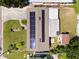 House with solar panels, detached shed, and a yard at 5575 6Th N Ave, St Petersburg, FL 33710