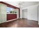 Bedroom with wood floors, ceiling fan, and white closet at 5575 6Th N Ave, St Petersburg, FL 33710