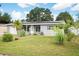 Newly renovated home with solar panels and a spacious lawn at 5575 6Th N Ave, St Petersburg, FL 33710