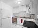White kitchen with appliances and granite countertops at 5575 6Th N Ave, St Petersburg, FL 33710
