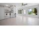 Open living room with kitchen and view to backyard at 5575 6Th N Ave, St Petersburg, FL 33710