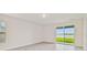 Bright bedroom with sliding glass doors leading to the backyard at 5552 Logan Cave Ave, Wimauma, FL 33598