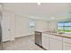 Modern kitchen featuring stainless steel appliances and an island at 5552 Logan Cave Ave, Wimauma, FL 33598