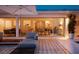 Beautiful modern outdoor living space with lounge seating and open access to the home's interior at 440 64Th Ave, St Pete Beach, FL 33706