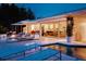 Beautiful modern outdoor living space with a pool and open access to the home's interior at 440 64Th Ave, St Pete Beach, FL 33706