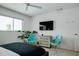 Inviting bedroom with modern furniture, stylish decor, a large window, and leafy plants for a fresh ambiance at 440 64Th Ave, St Pete Beach, FL 33706