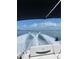 Open boat cruising with a wake, showing the experience of recreational activities and waterfront living at 440 64Th Ave, St Pete Beach, FL 33706