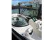 Two white boats docked at a pier, highlighting their sleek design and comfortable seating at 440 64Th Ave, St Pete Beach, FL 33706