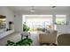 Bright living room boasts water views, modern decor, and access to a patio at 440 64Th Ave, St Pete Beach, FL 33706