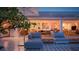 Inviting outdoor patio with comfortable lounge furniture and seamless transition to indoor living spaces at 440 64Th Ave, St Pete Beach, FL 33706