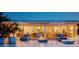 Expansive patio offering seamless indoor/outdoor living with lounge seating, a fire pit, and access to a bright, open interior at 440 64Th Ave, St Pete Beach, FL 33706